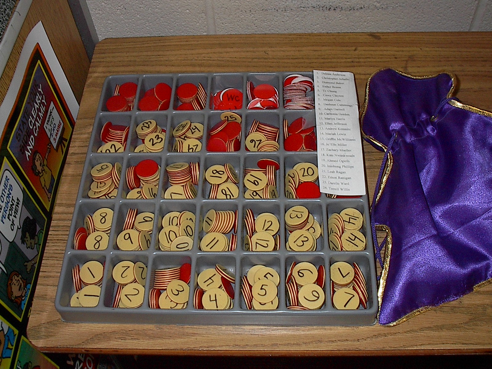 To hold my tokens, I used a random container inherited from a retiring teacher. I’ve never seen anything like it in stores, but suggest using a divided plastic container with lid (see the product recommendations below) The bag on the right was purchased from the dollar store. I kept a list of student names and their corresponding numbers taped to the container.